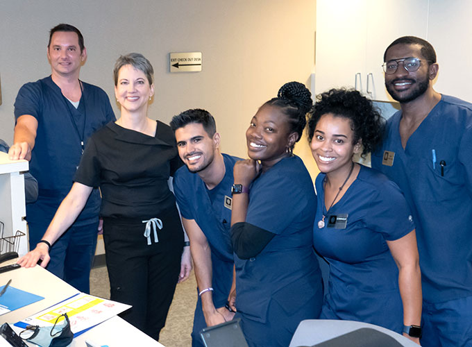 Doctor posing with staff